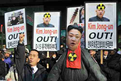 S. Korean activists demonstrate behind an effigy of Kim Jong-un in Seoul on Feb 13