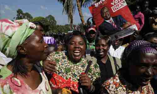 Kenyatta supporters celebrate victory on Saturday (AFP)