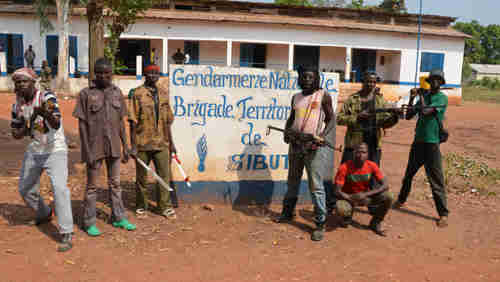 Seleka rebels pose for photo op in front of suburban gendarmerie (police station) in January (Getty)