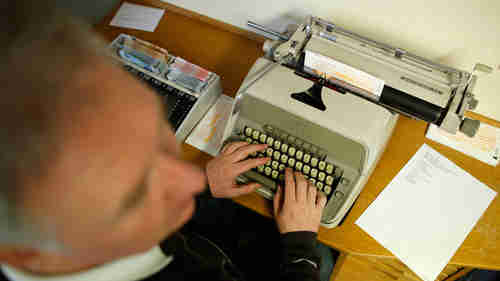 Presumably a Russian agent typing on an electric typewriter (RT)