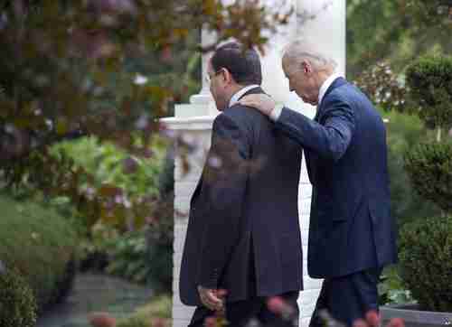 Vice President Joe Biden walks with Nuri al-Maliki on Wednesday (AP)
