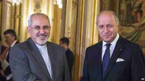 Iran's foreign minister Jawad Zarif and France's foreign minister Laurent Fabius (VOA)