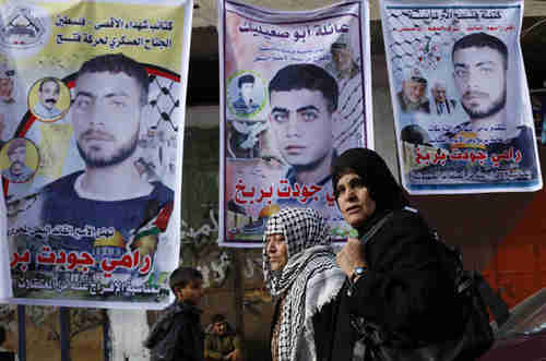 Palestinian families in the occupied West Bank and Gaza make preparations to receive the released prisoners (Reuters)