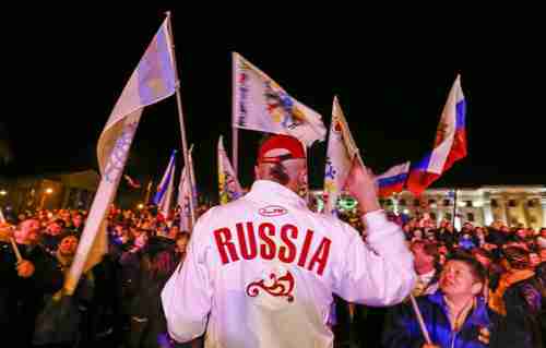 Russia supporters celebrate in Simferopol, Crimea, on Friday (Reuters)