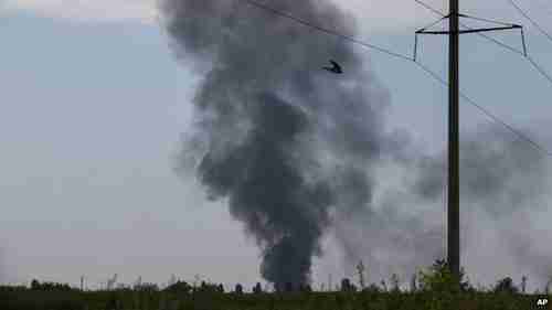 Black smoke rising from the scene of the helicopter crash (AP)