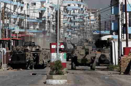 Lebanon's army tanks arrive in neighborhoods of Tripoli in northern Lebanon (AP)