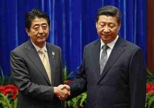Ice cold handshake Monday between Xi Jinping and Shinzo Abe