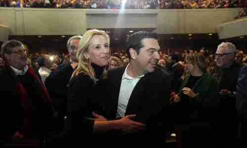 Syriza leader Alexis Tspiras dances with party official Rena Dourou at pre-election rally last month (EPA)