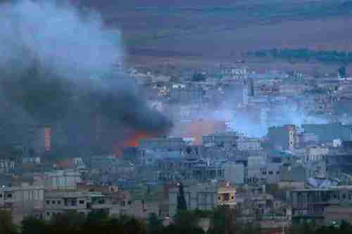  A fire burns in Kobani Syria during heavy fighting between ISIS and Kurdish Peshmerga forces (Reuters)