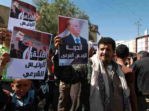 Anti-Houthi demonstrations in Sanaa on Saturday.  The posters have pictures of Hadi (AFP)