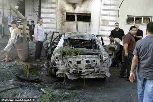 One of five cars in Gaza blown up by explosions in Gaza early Sunday morning (AFP)