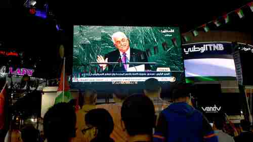 Palestinians in Ramallah, West Bank, watch Abbas's UN speech on Wednesday (AP)