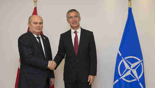 NATO Secretary General Jens Stoltenberg (R) expressing solidarity with Minister of Foreign Affairs of Turkey, Feridun Sinirlioglu, in Brussels on Monday