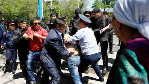 Riot police confront protesters on Saturday in Almaty, Kazakhstan's largest city (Reuters)