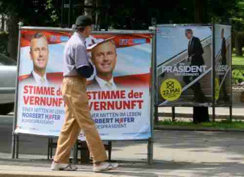 Election posters for Norbert Hofer (L) and Alexander van der Bellen. (AP)