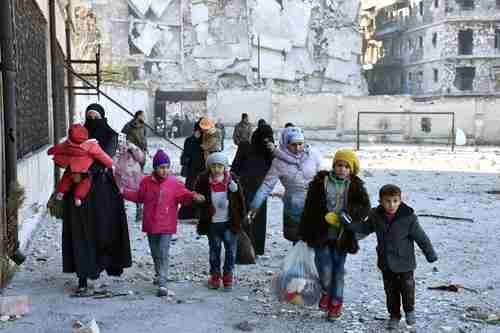 A family of Sunni 'terrorists' flee the fighting in Aleppo (Reuters)