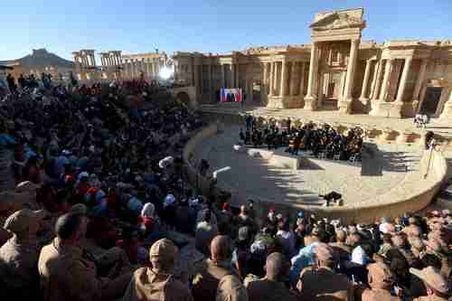 Russia holds a concert on 5-May to celebrate the recapture of Palmyra from ISIS. Note that Vladimir Putin is on the wide-screen tv on the left side of the stage (AFP)