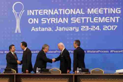 Politicians shake hands and congratulate each other at Tuesday's conclusion of the Syria peace negotiations (AP)