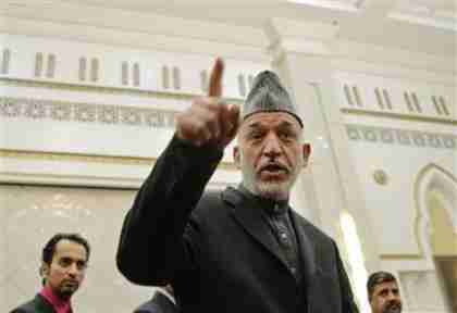 Afghan president Hamid Karzai at news conference on Sunday (Reuters)